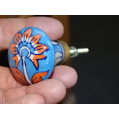 turquoise pear shaped button and orange flower