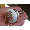 White porcelain handle with 4 round metal ornament