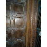 Patinated house door in dark with steel fittings