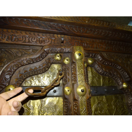Old cabinet doors decorated with camel motifs brass plates
