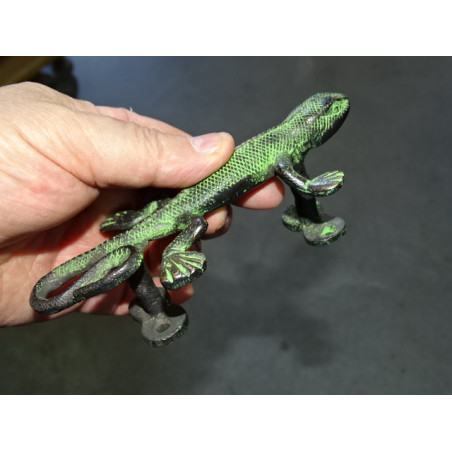 bronze handle in the shape of a green patinated salamander