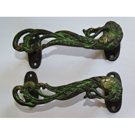 Bronze handle in the shape of a black and green patinated peacock - left