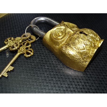 Indian padlock in the shape of a weathered golden owl