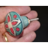 turquoise green pear-shaped button and red flower